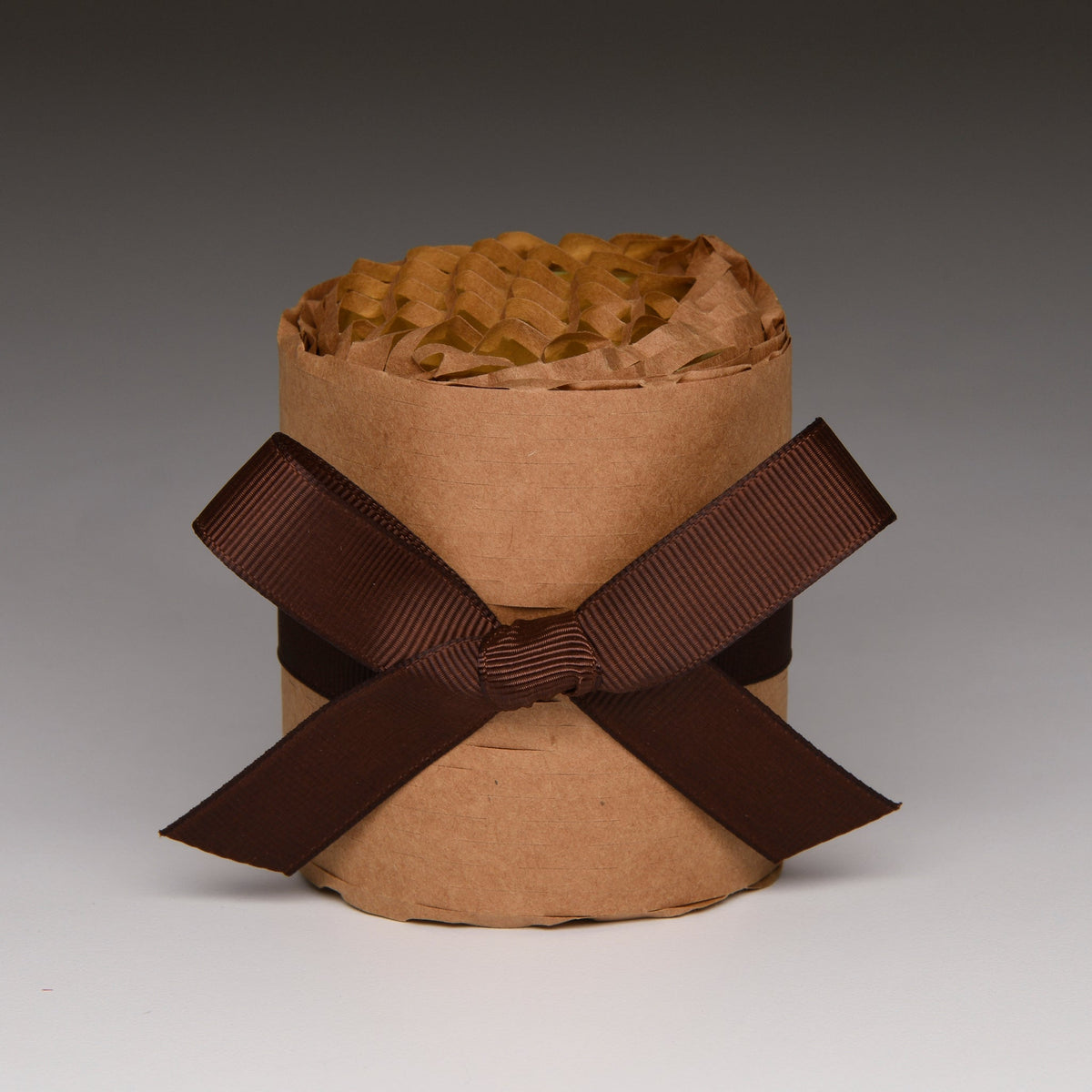 Fall Vibe Petite candle gift-wrapped in kraft paper with a brown bow
