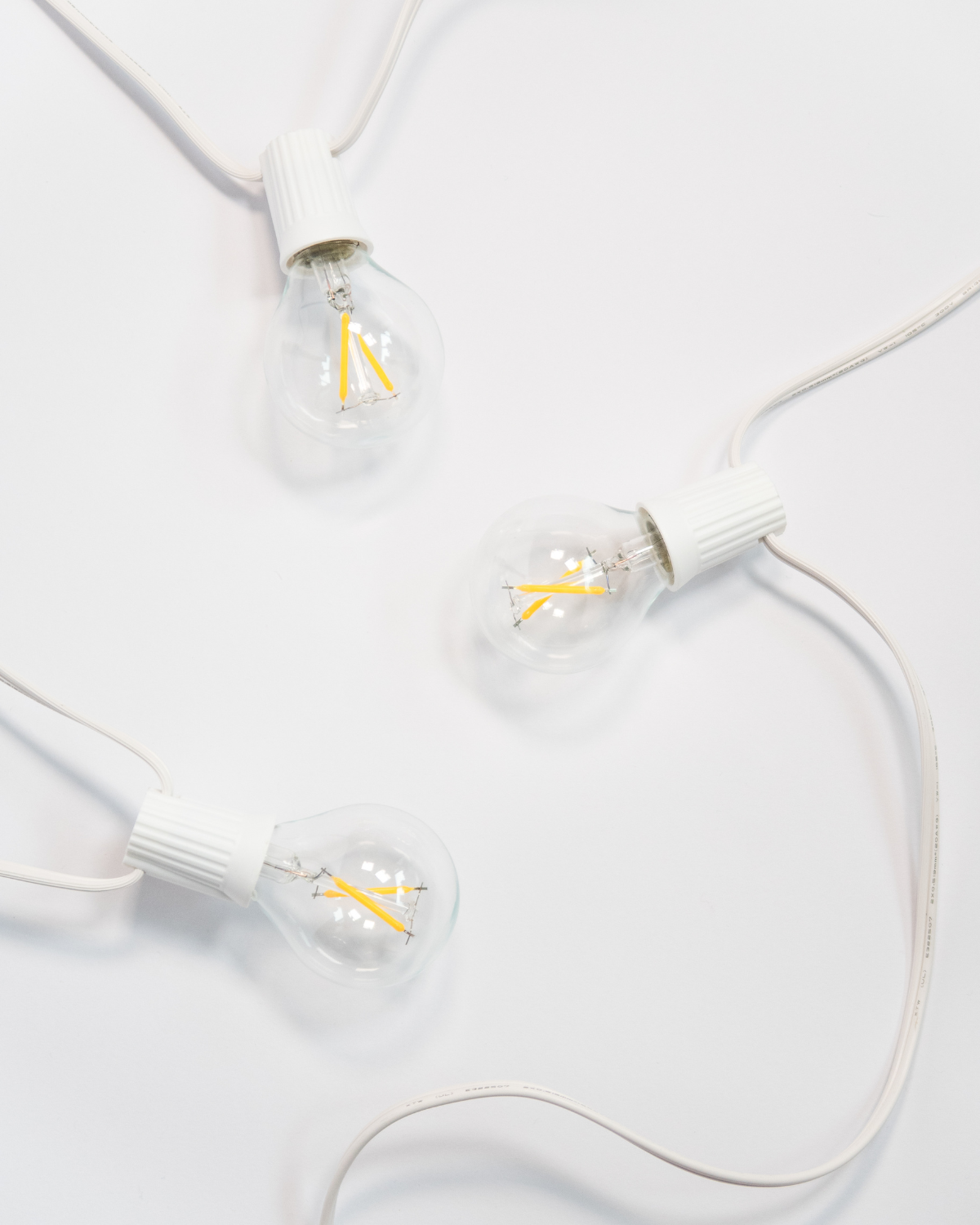 Ambience Globe string lights with a white cord and clear Edison-style bulbs