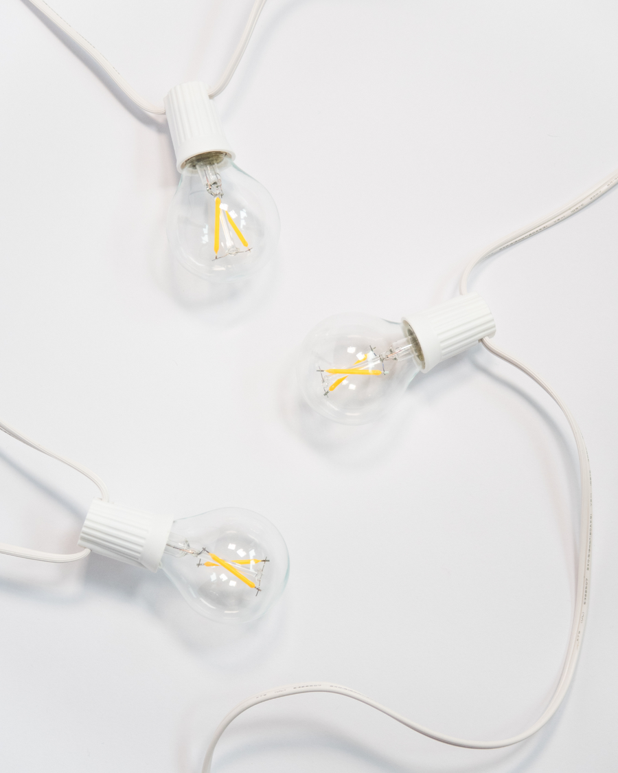Ambience Globe string lights with a white cord and clear Edison-style bulbs
