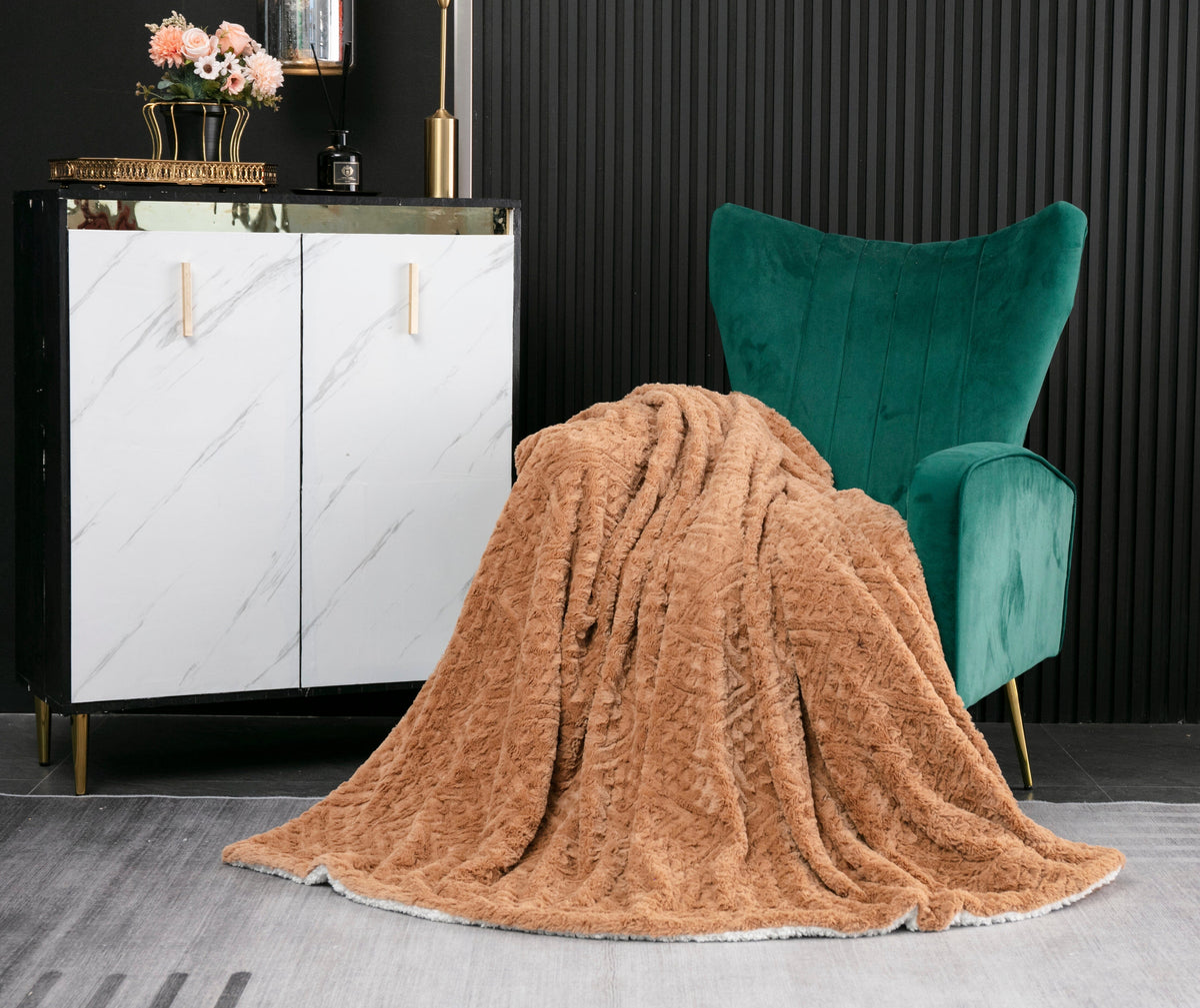 Caramel Chevron throw draped near a green velvet armchair
