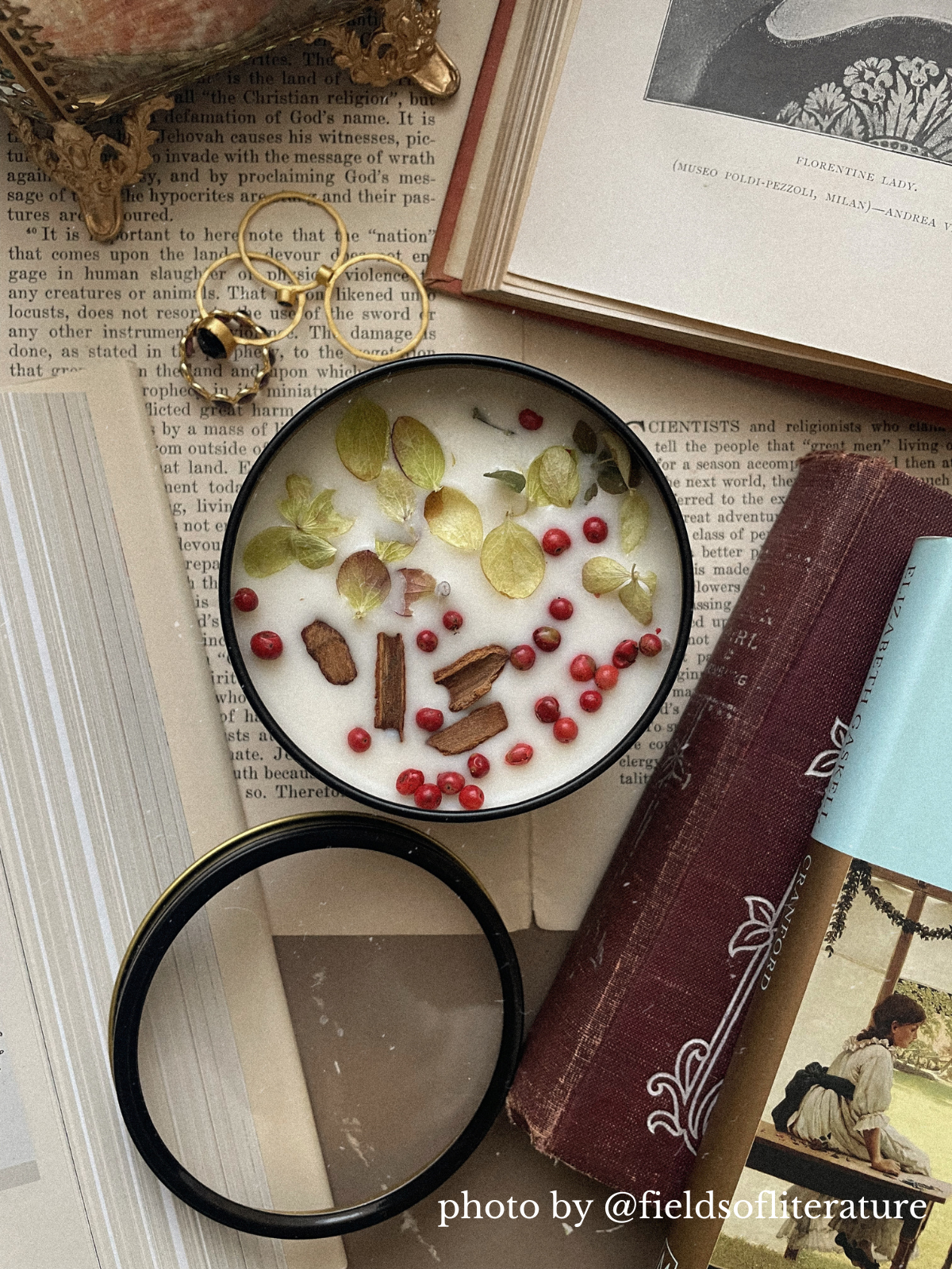 Open HARVEST candle tin beside an open book