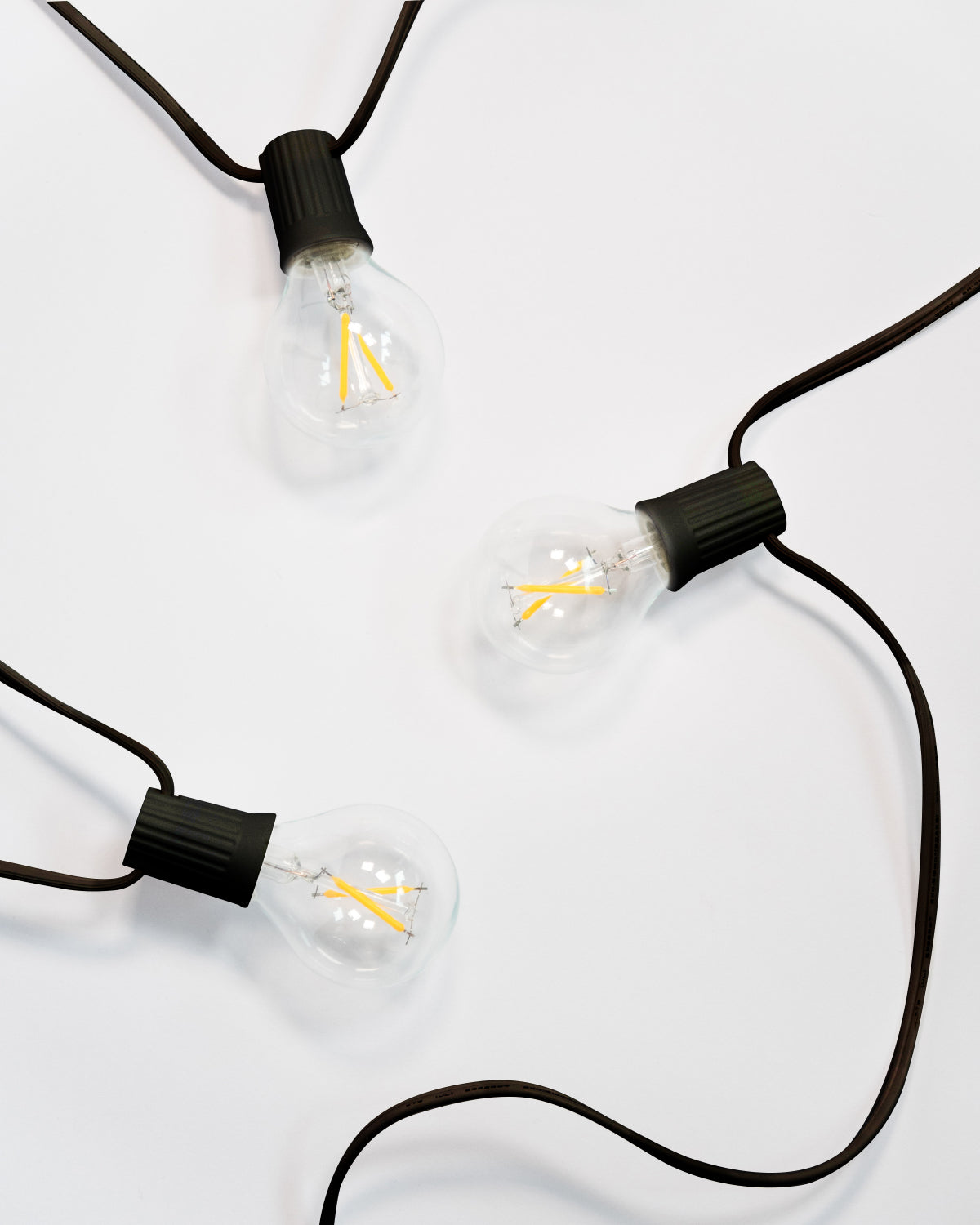 Ambience Globe string lights with a black cord and clear bulbs