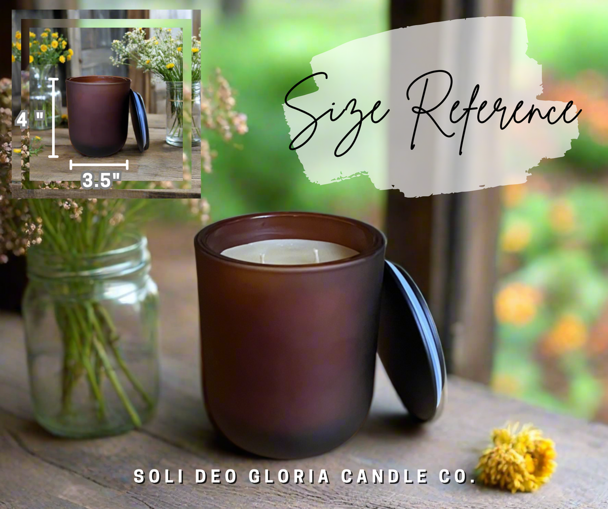 Size reference: the frosted amber Pumpkin Pie candle next to a mason jar of flowers