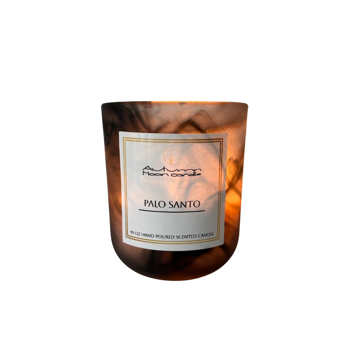 Lit 10 oz candle in a glass vessel with a smoky swirl pattern