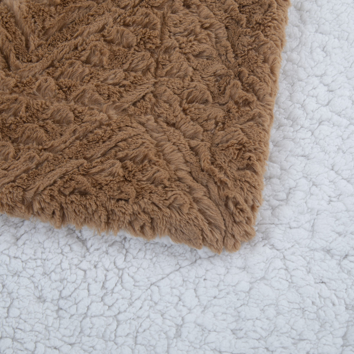 Caramel faux fur folded over the white sherpa back
