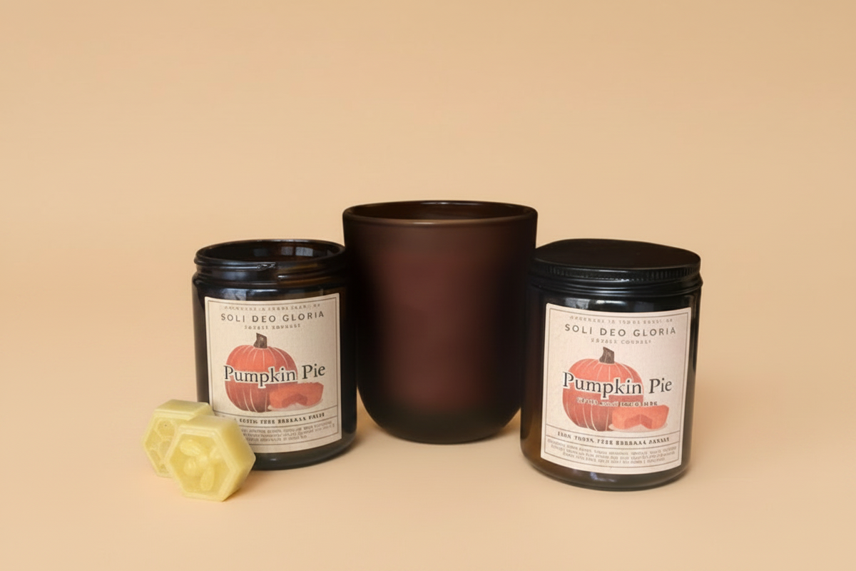 Pumpkin Pie beeswax candles in amber and frosted amber jars