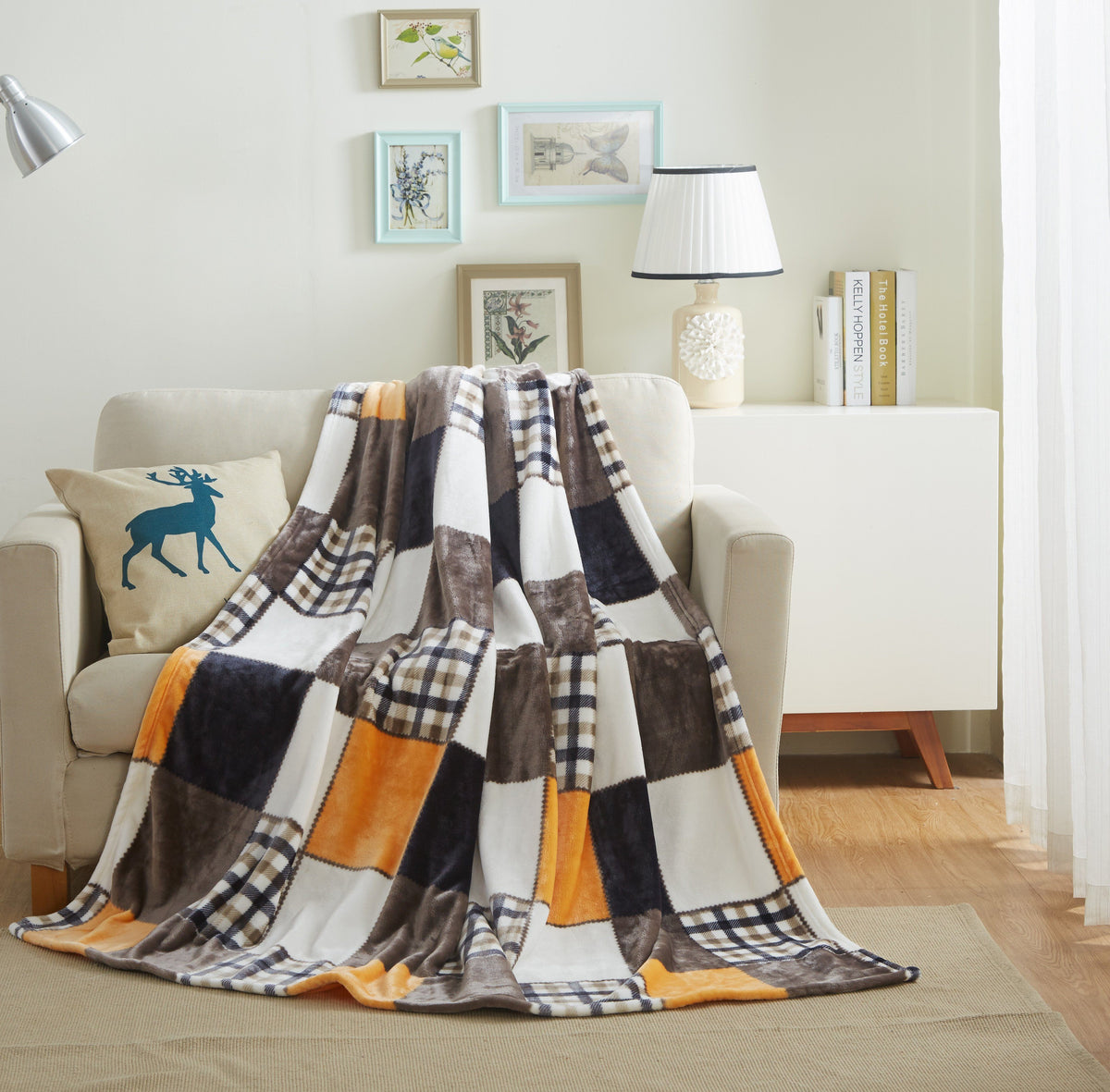 Harvest Patchwork Fleece Throw draped over a cream armchair in a living room