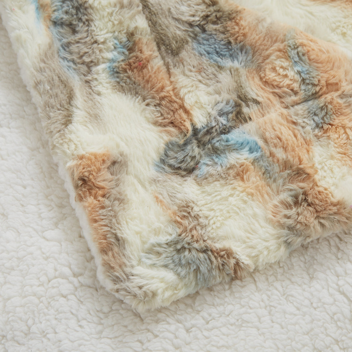 Corner of the Russian Lynx throw, faux fur on top and sherpa underneath