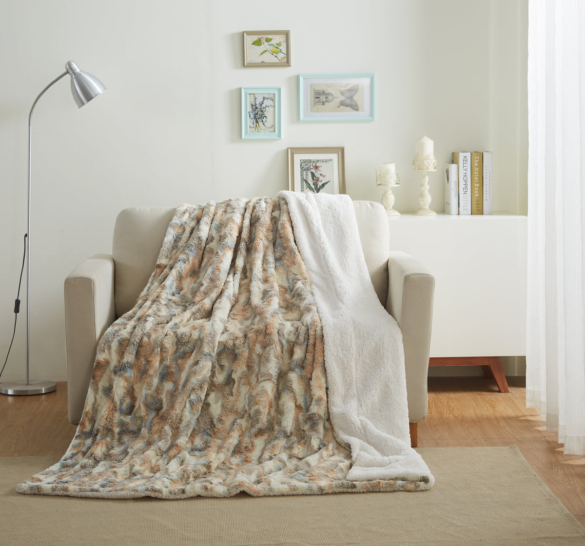 Russian Lynx faux fur throw draped over a cream armchair in a bright living room