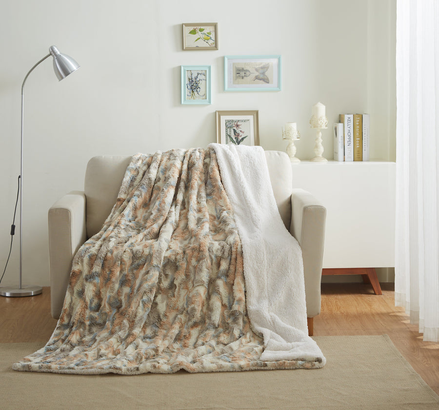 Russian Lynx faux fur throw draped over a cream armchair in a bright living room