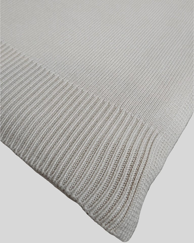 Close-up of the Classic Drift throw's fine knit and ribbed border