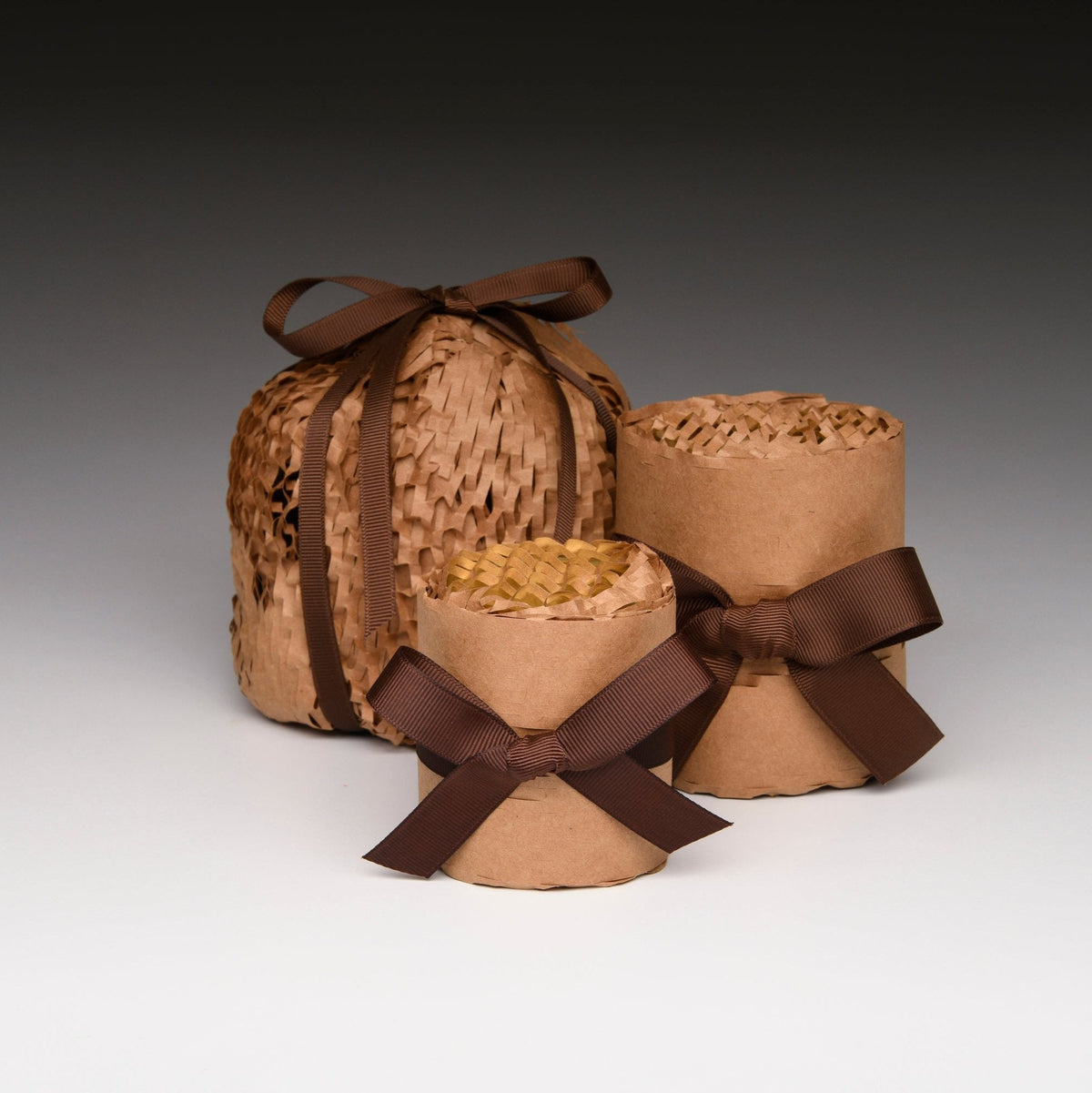 Fall Vibe candles gift-wrapped in kraft paper and brown ribbon